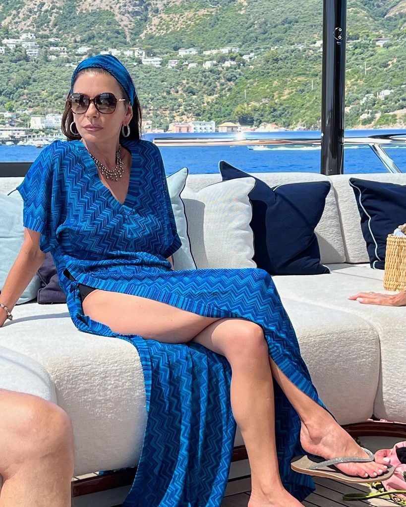 Catherine Zeta Jones in blue beach dress on boat