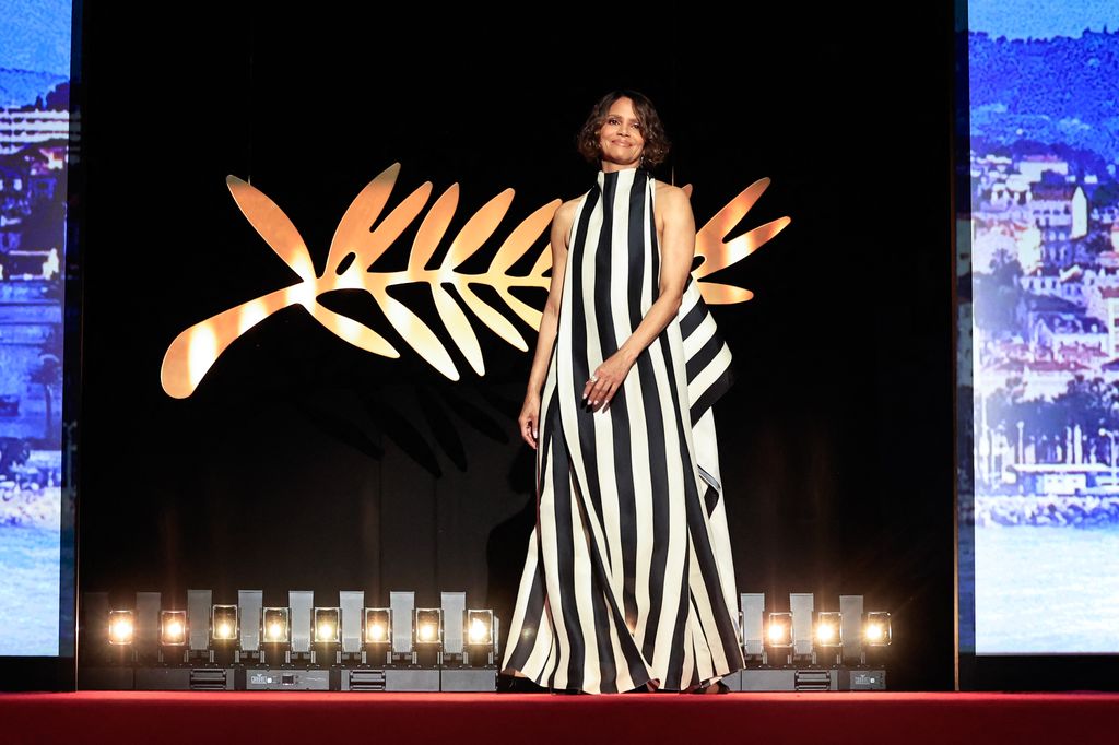 US actress and member of the jury of the 78th cannes film festival Halle Berry arrives on stage during the Opening Ceremony and the screening of the film "Partir un Jour" (Bye Bye) presented out of competition at the 78th edition of the Cannes Film Festival
