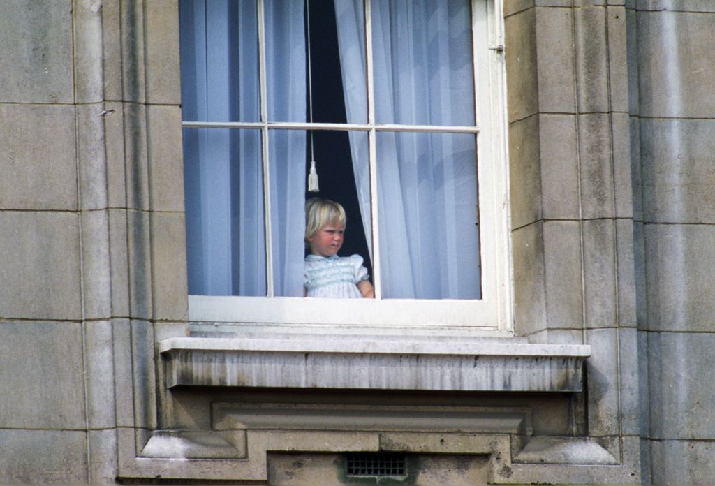 Zara Phillips peering out of window at Buckingham Palace