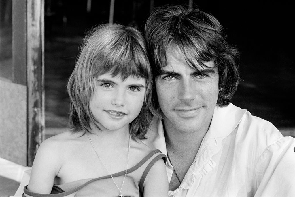 Black-and-white photo of Michael Wilding Jr. with his daughter