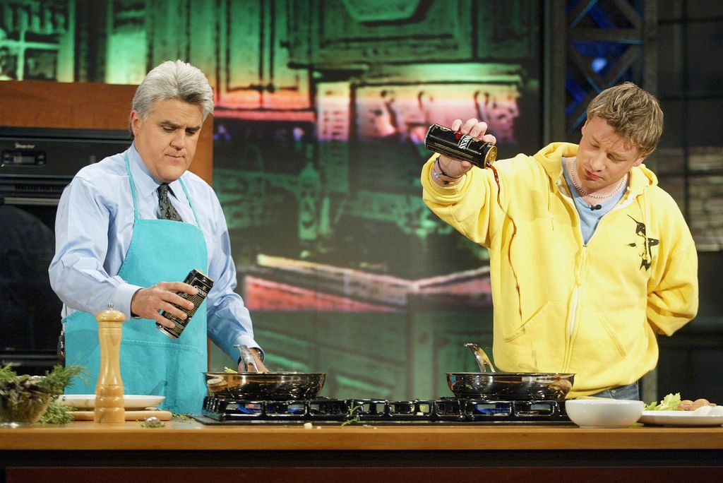 Jamie Oliver, "The Naked Chef" (R) appears on "The Tonight Show with Jay Leno" at the NBC Studios on May 5, 2003 in Burbank, California