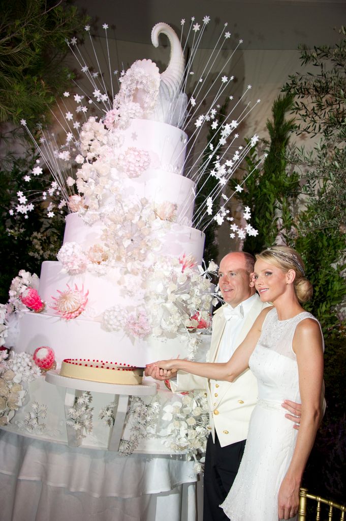 Princess Charlene of Monaco and Prince Albert II of Monaco cut their wedding cake