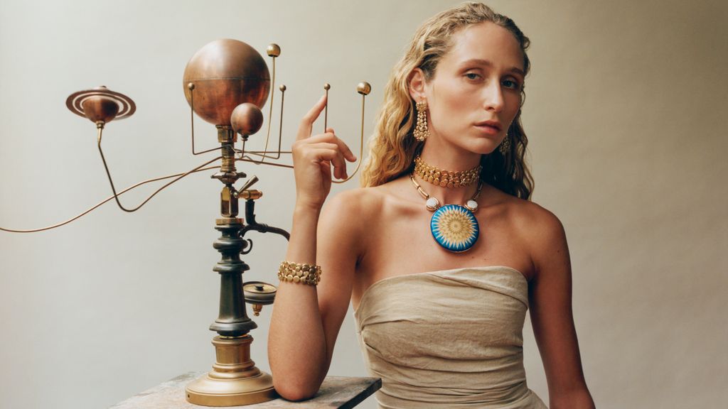 model wearing solar system-inspired jewellery 