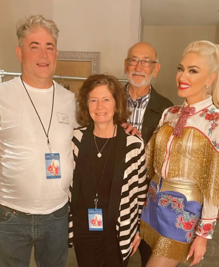 Gwen posing with her parents during show