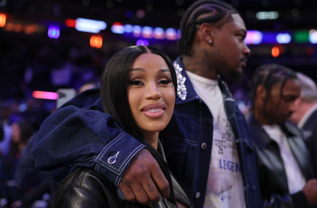 photo of cardi b with stefon diggs arm around her shoulder