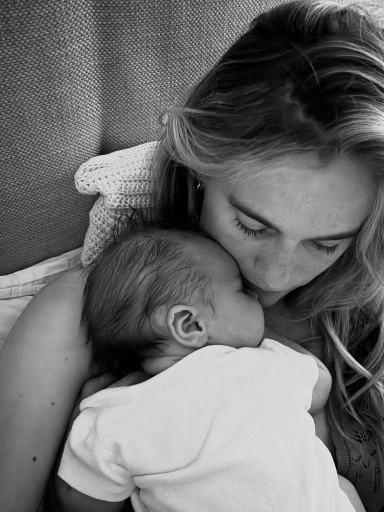 cressida bonas cradling baby daughter Delphina