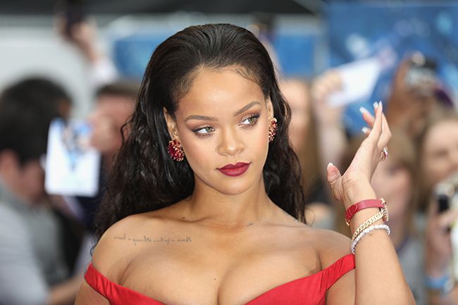 Rihanna in red dress at event