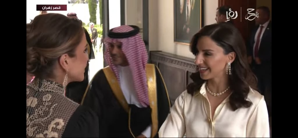 Queen Rania of Jordan showing off back of black Dior dress at royal wedding