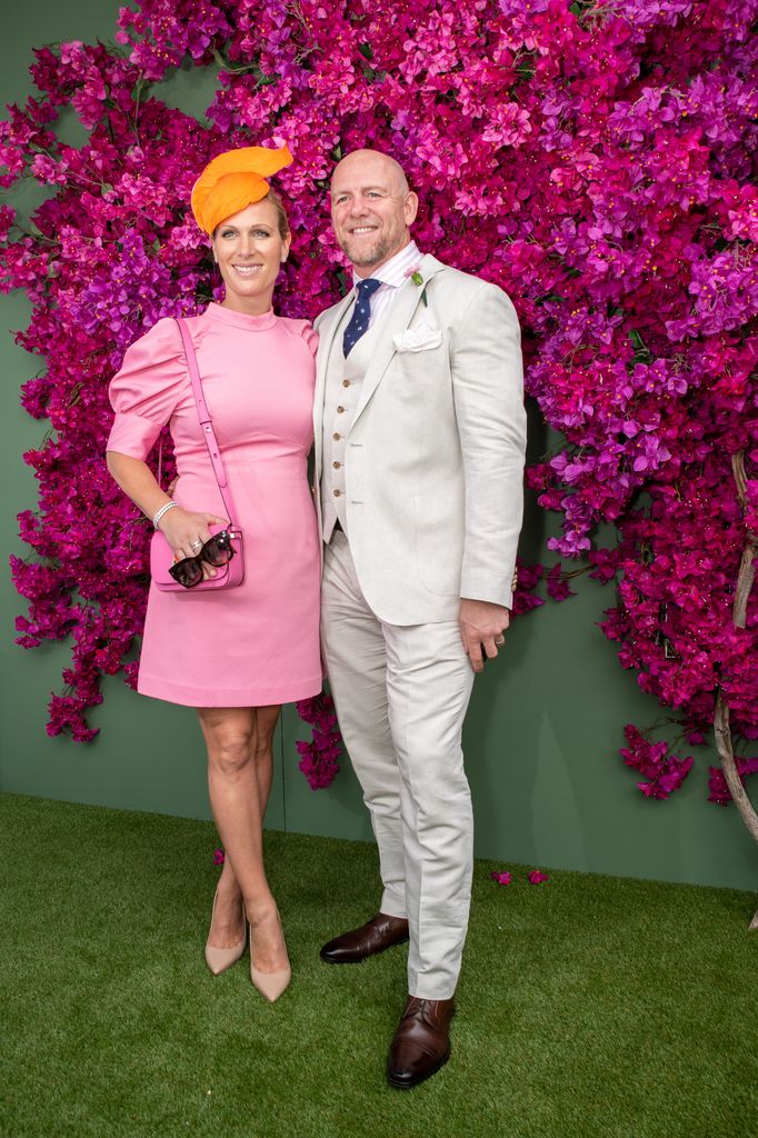 Zara Tindall in pink dress and Mike Tindall in white suit