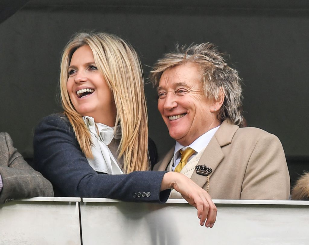 Rod Stewart and Penny Lancaster smiling at races