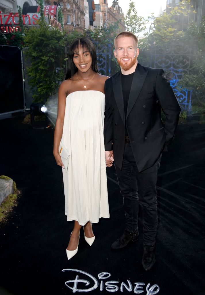 Chyna Mills in a white dress and Neil Jones in a black suit