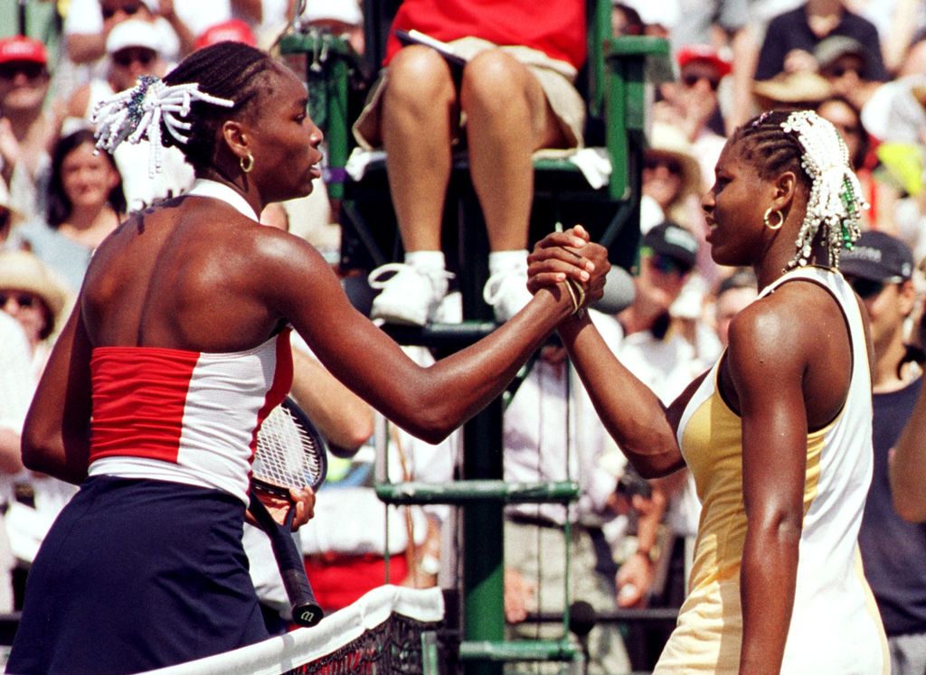 Venus Williams and Serena Williams shake hands