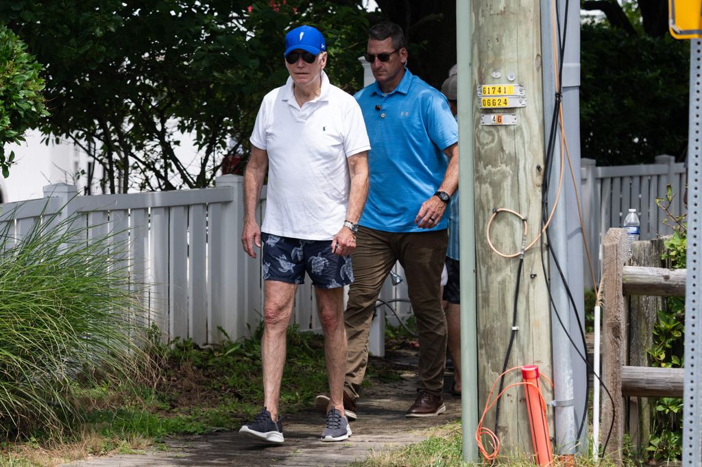 US President Joe Biden leaves the beach near his home in Rehoboth Beach, Delaware, July 8, 2023, as he spends the weekend at his vacation home.