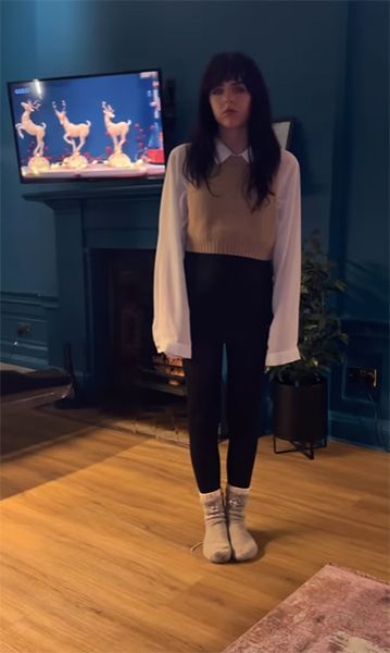 Coleen Nolans daughter standing blankly by an undecorated Christmas tree