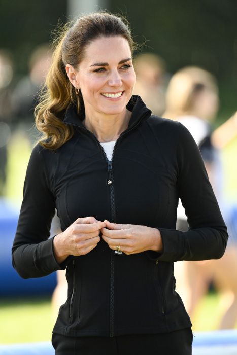 princess kate wearing a black zip up workout jacket by lululemon