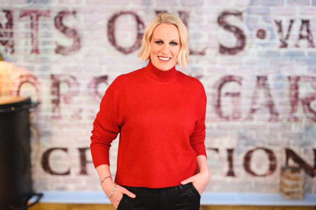 steph mcgovern wearing red top and posing with hands in pockets