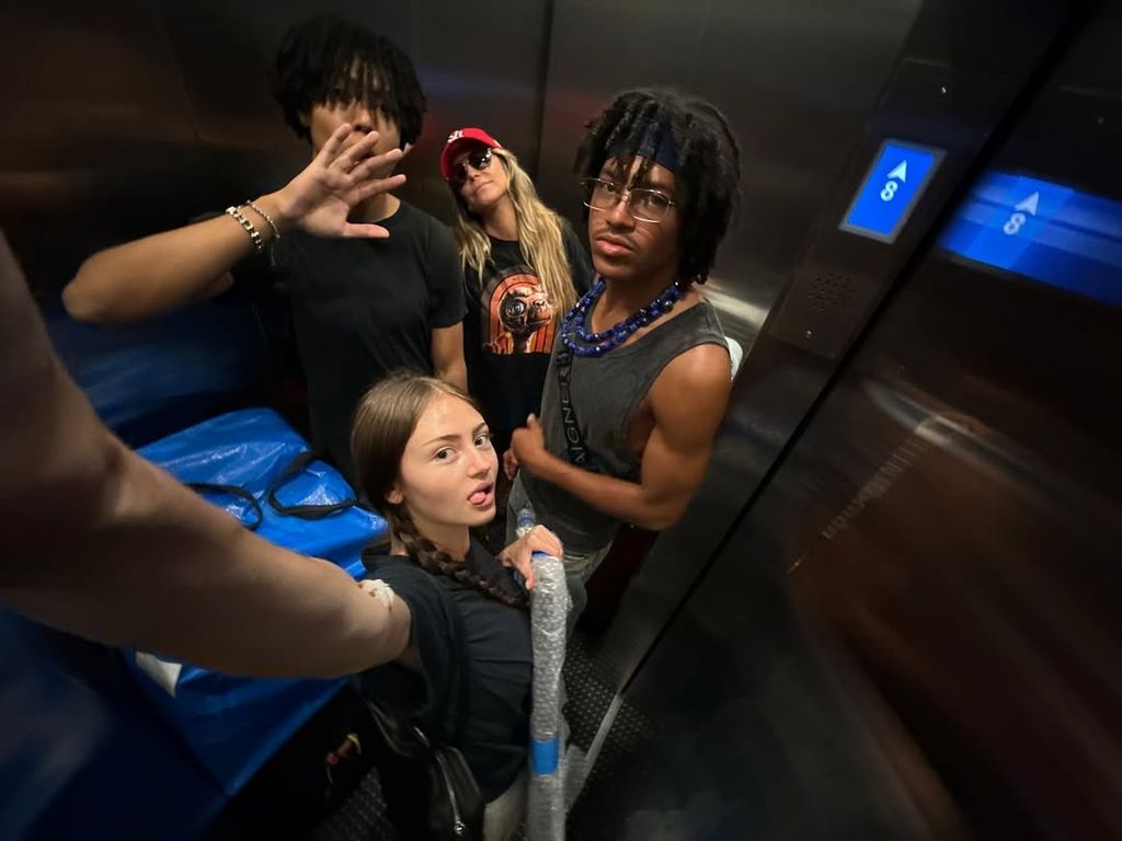 Heidi posing with her three children