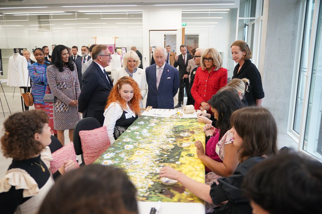 King Charles and Queen Camilla view artists in the  Maison Lesage embroidery section 