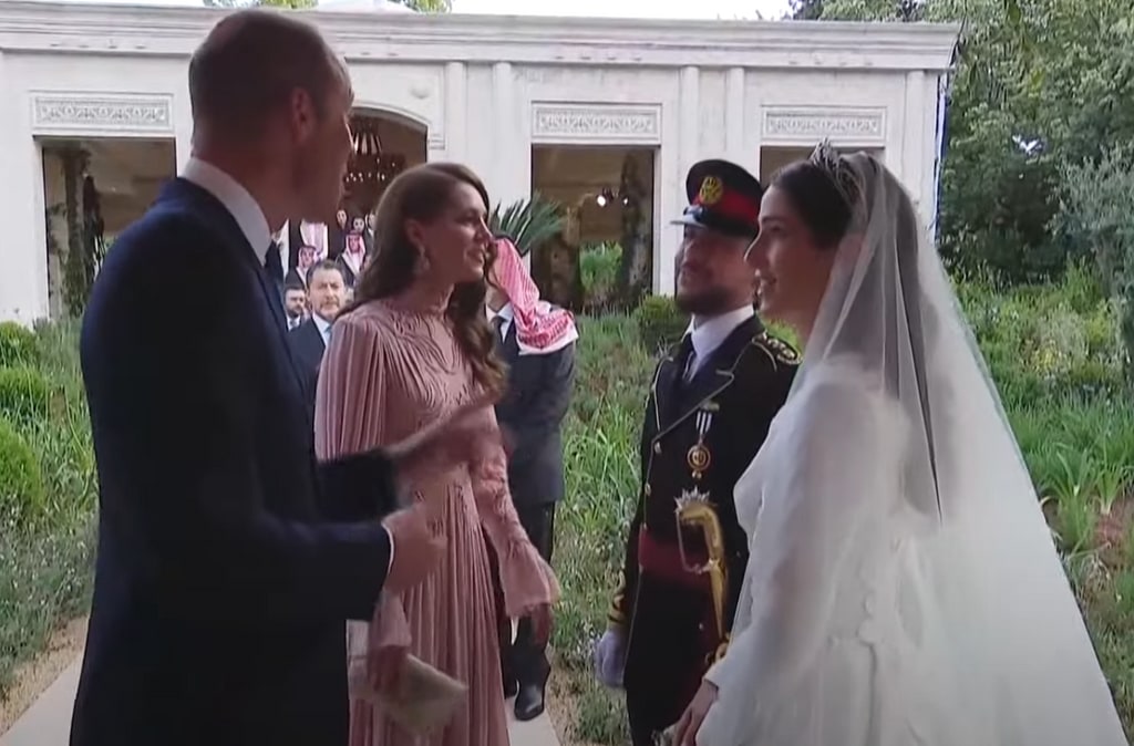 Prince William and Kate talking to Prince Hussein and Rajwa after the wedding