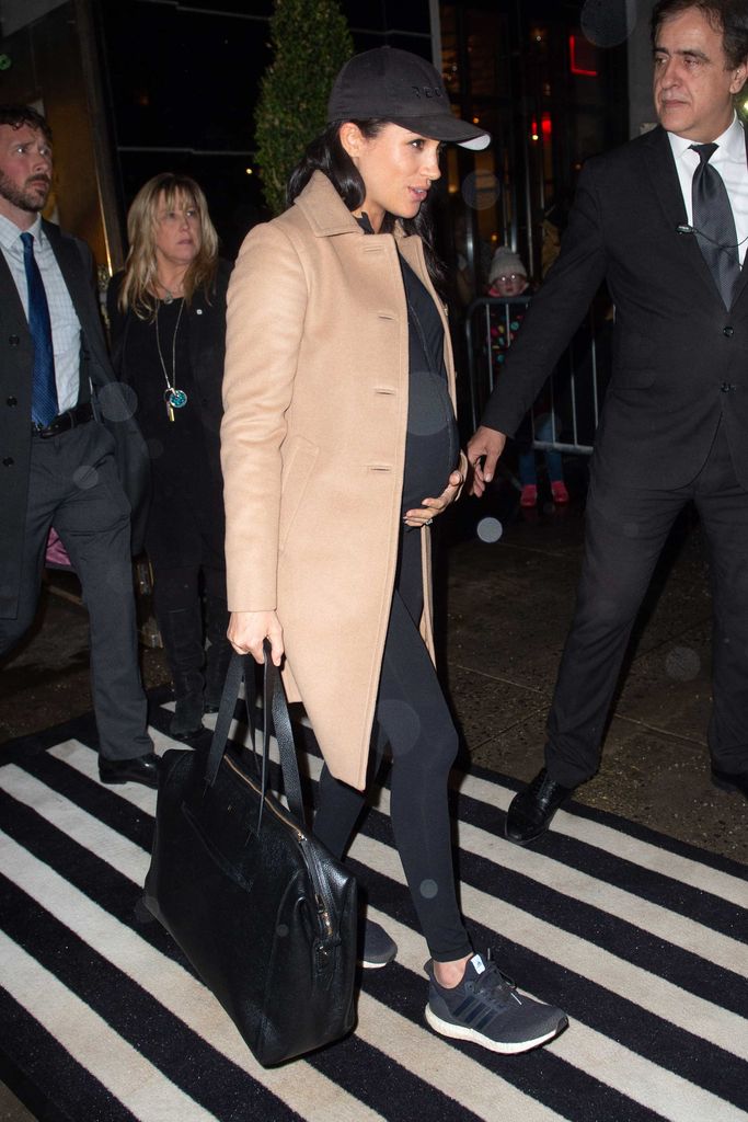 Pregnant Meghan Markle wearing all-black and camel coat in New York 2019