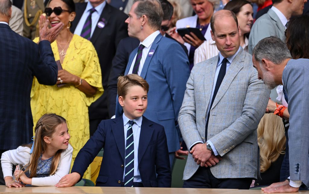 Princess Charlotte speaking with King Felipe VI of Spain with william and george