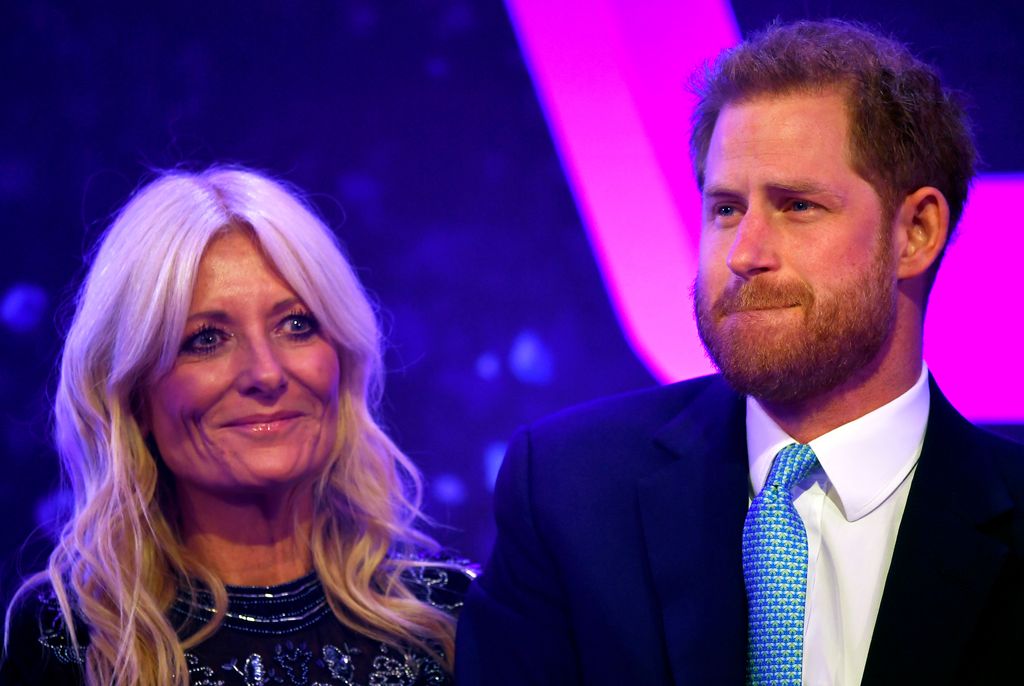 Prince Harry reacts next to television presenter Gaby Roslin as he delivers a speech during the WellChild Awards at Royal Lancaster Hotel in 2019 