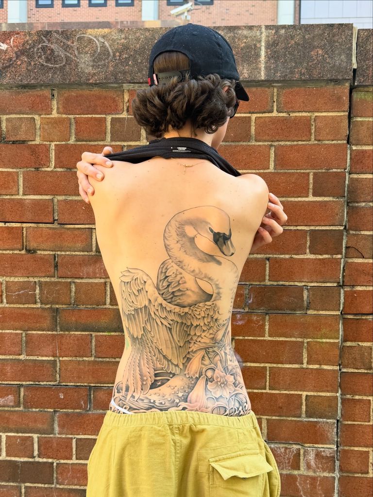 photo of ella emhoff huge swan tattoo on back