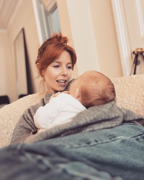 stacey dooley holding baby daughter 