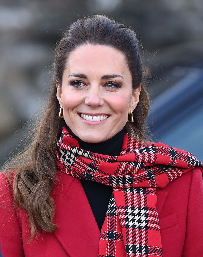 Kate Middleton visits Cardiff Castle on December 8, 2020 in Cardiff, Wales wearing red coat and tartan scarf