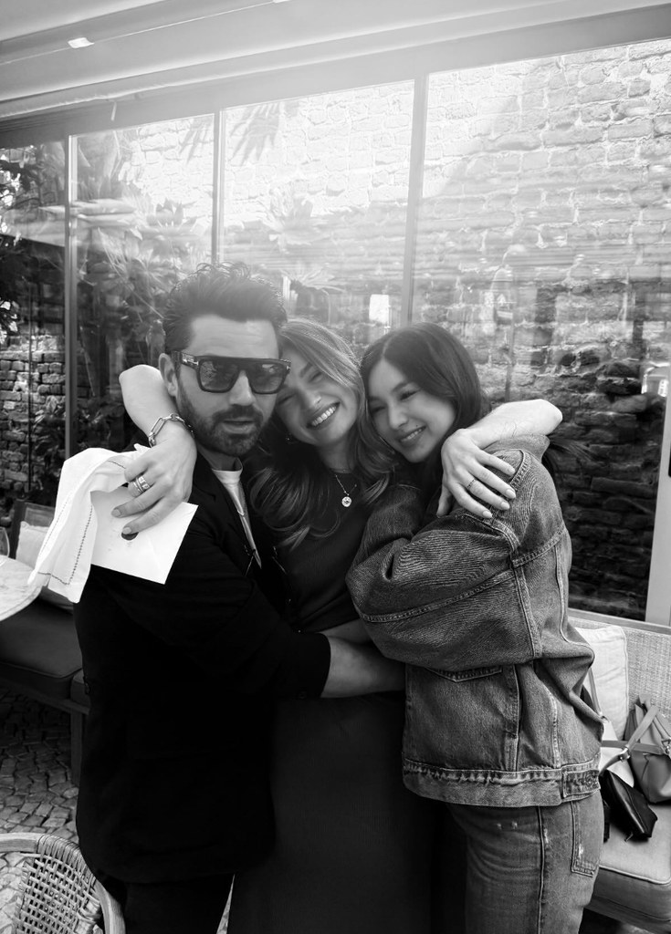 lily james hugging gemma chan and dominic cooper