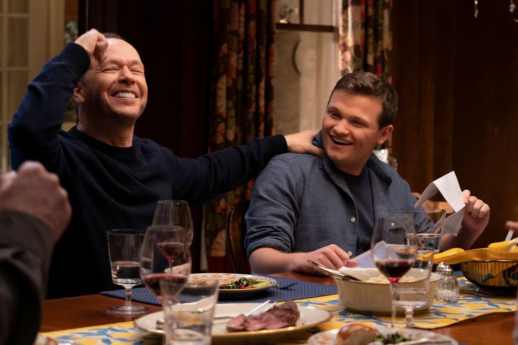 Donnie Wahlberg as Danny Reagan, Andrew Terraciano as Sean Reagan on Blue Bloods in 2022