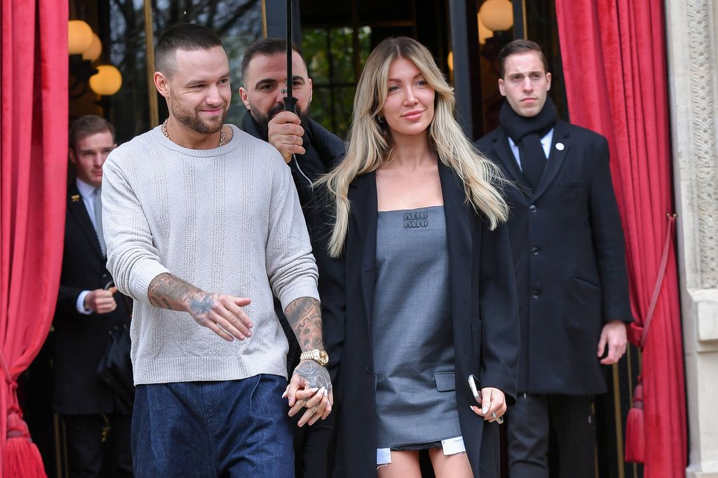 Liam Payne and Katie Cassidy leaving a hotel