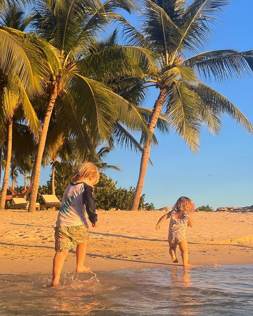 Carrie Johnson's children, Wilfred and Romy, playing on the beach