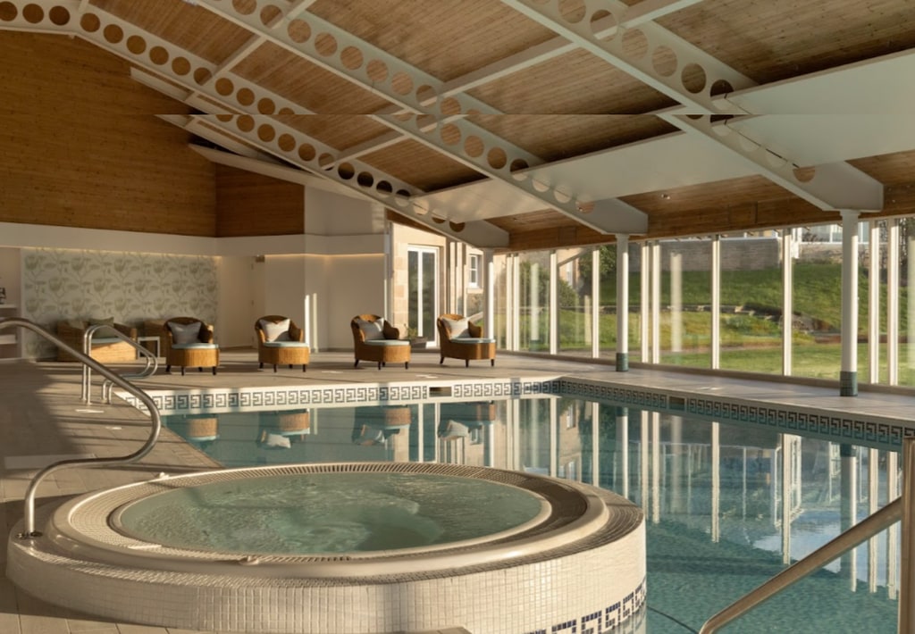 The interior of a spa with a swimming pool and hot tub