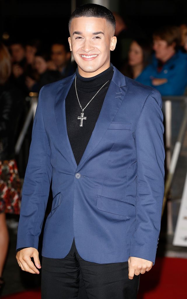 Jahmene Douglas in a blue suit jacket and cross necklace at the MOBO Awards