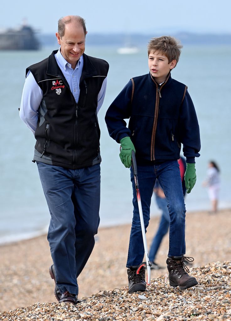 Prince Edward walking alongside James, Earl of Wessex on a beach