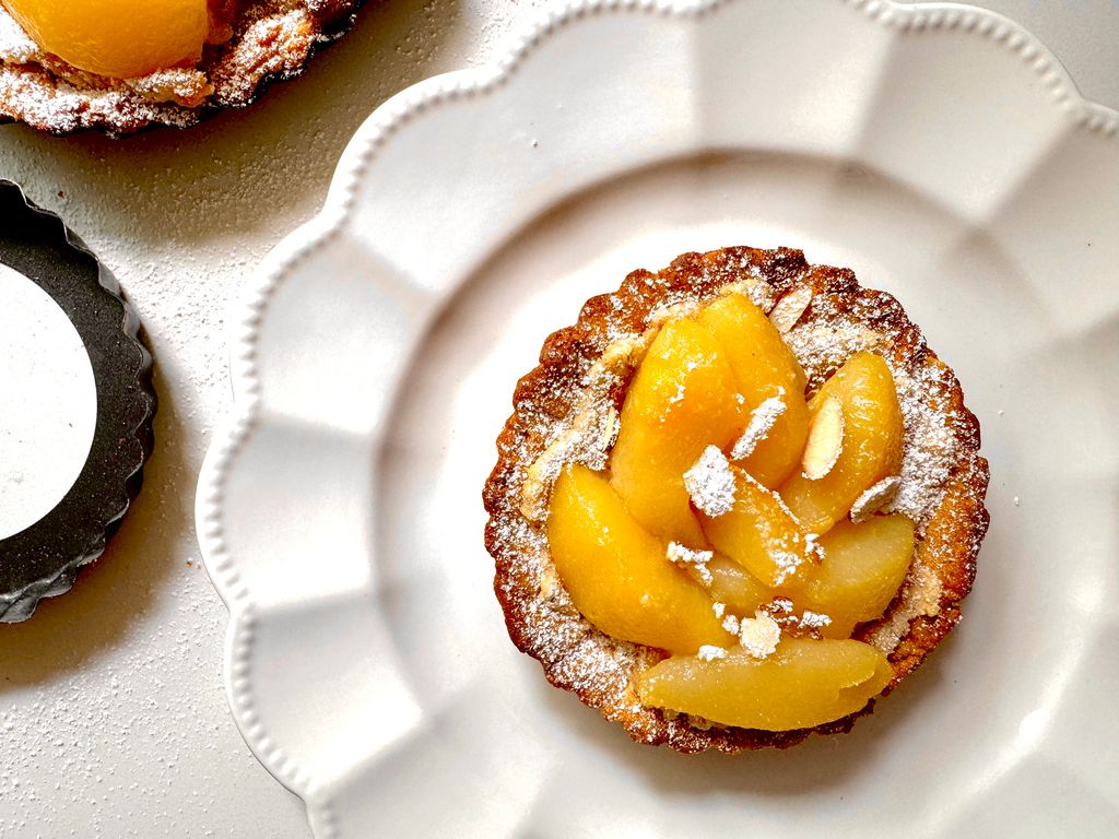 Pear flan on white plate