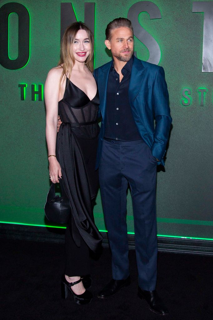 Morgana McNelis in black dress and Charlie Hunnam in navy suit at  the Netflix's "Monster: The Ed Gein Story" New York Premiere at The Plaza Hotel 