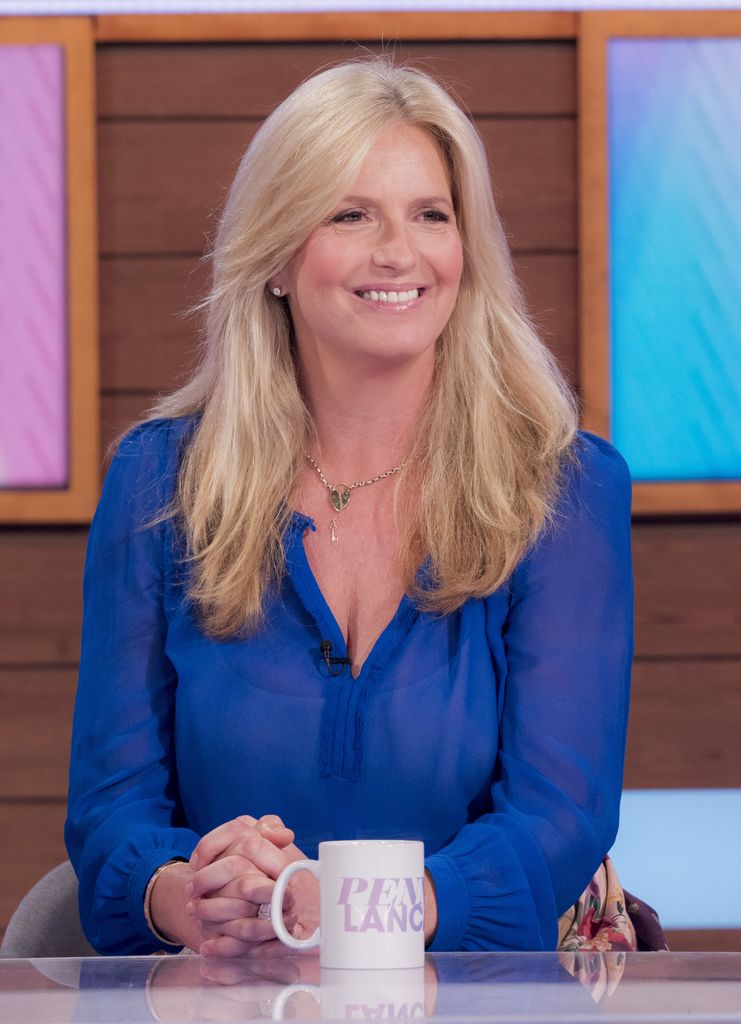 Penny Lancaster smiling in a blue top on Loose Women