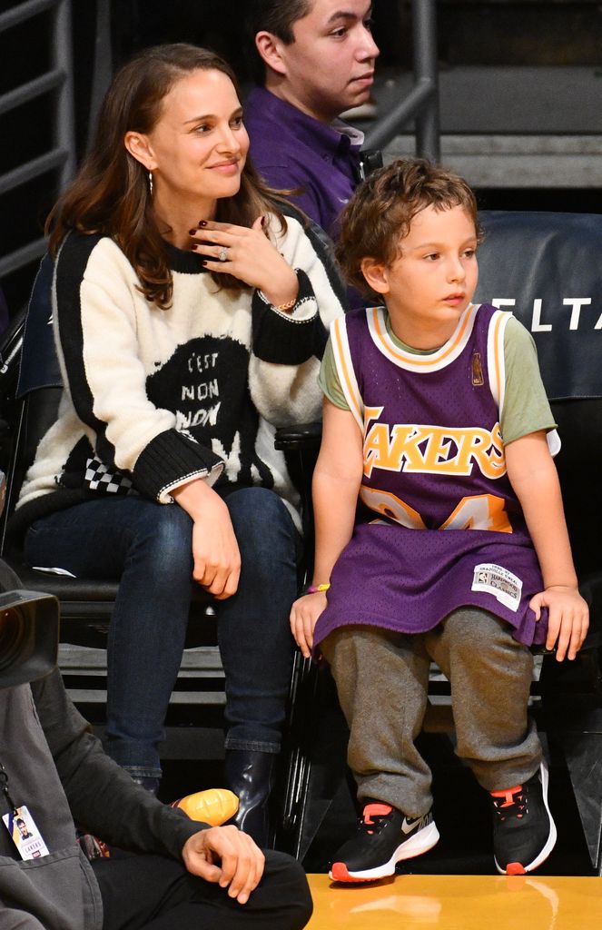 Natalie Portman and her son Aleph Portman-Millepied attend a basketball game