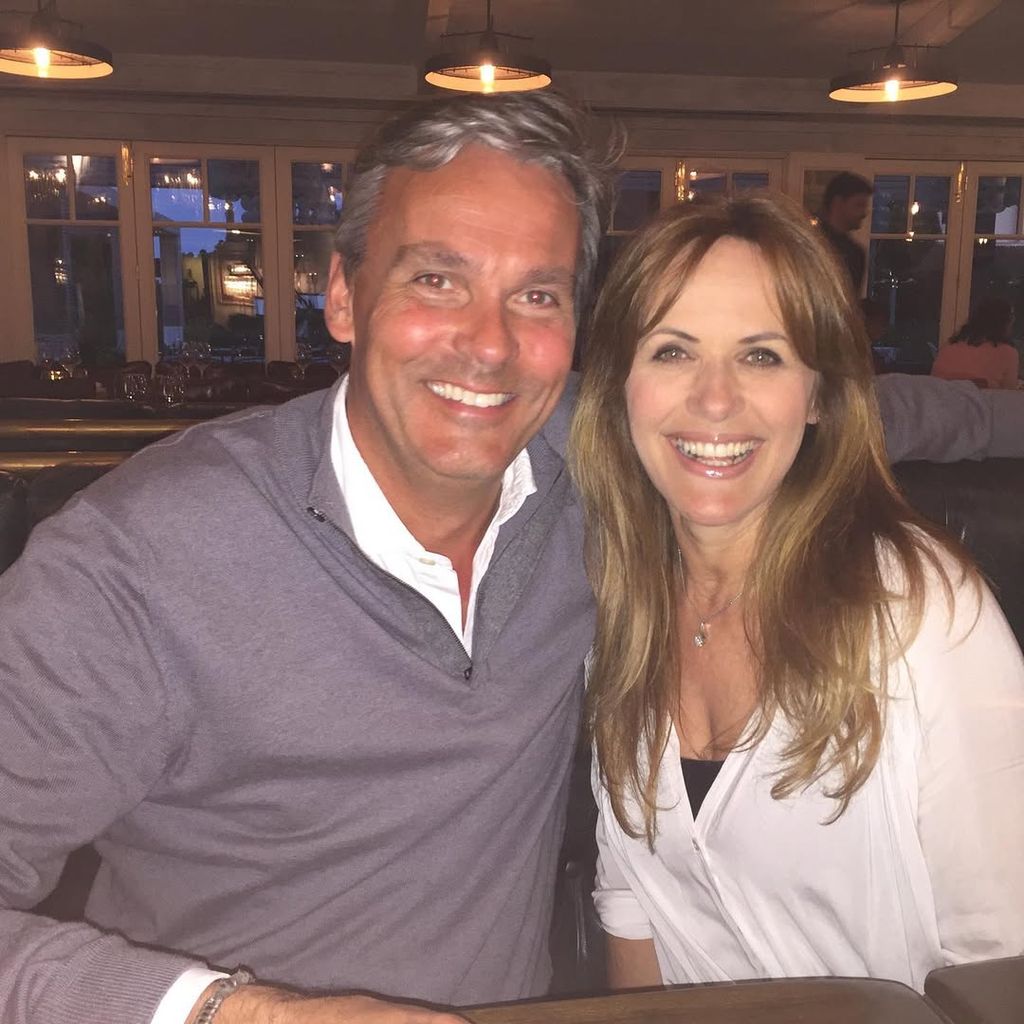man and woman smiling in restaurant