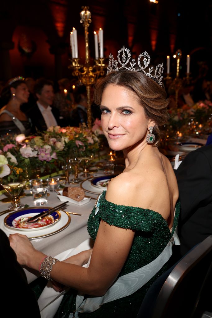 Princess Madeleine looking over one shoulder at banquet