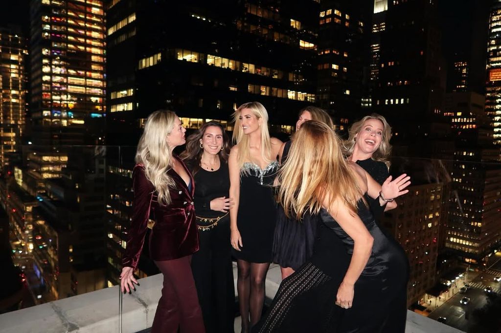 Ivanka Trump in black dress laughing with friends in NYC