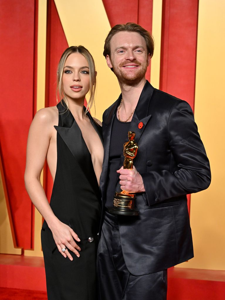 Claudia Sulewski and Finneas O'Connell attend the 2024 Vanity Fair Oscar Party 