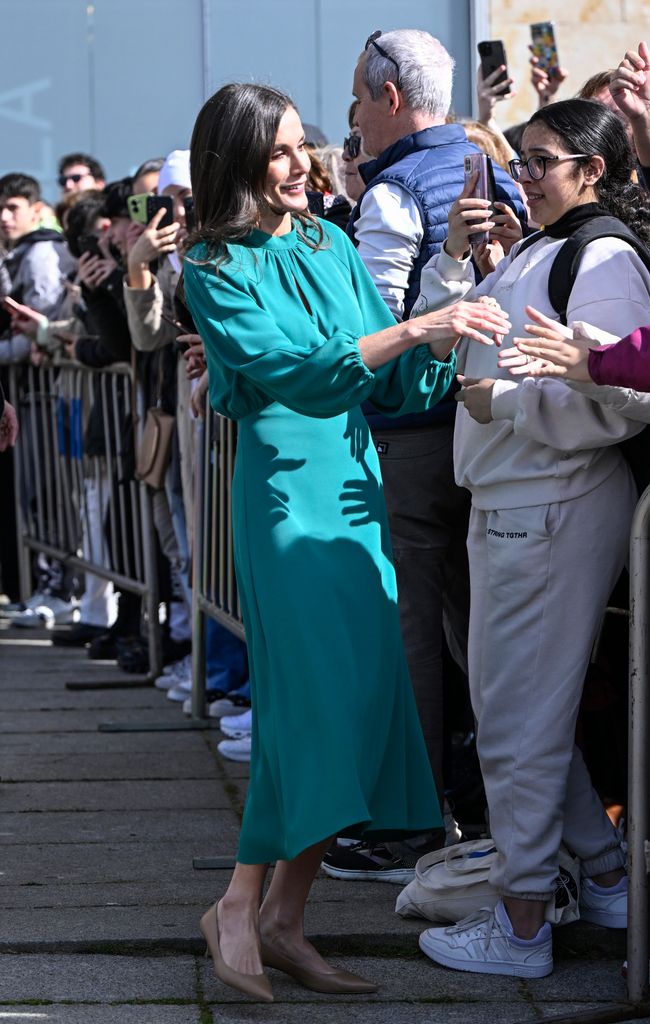 Queen Letizia meeting the public in green dress