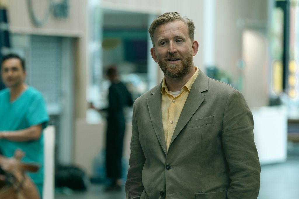 man in suit standing in street