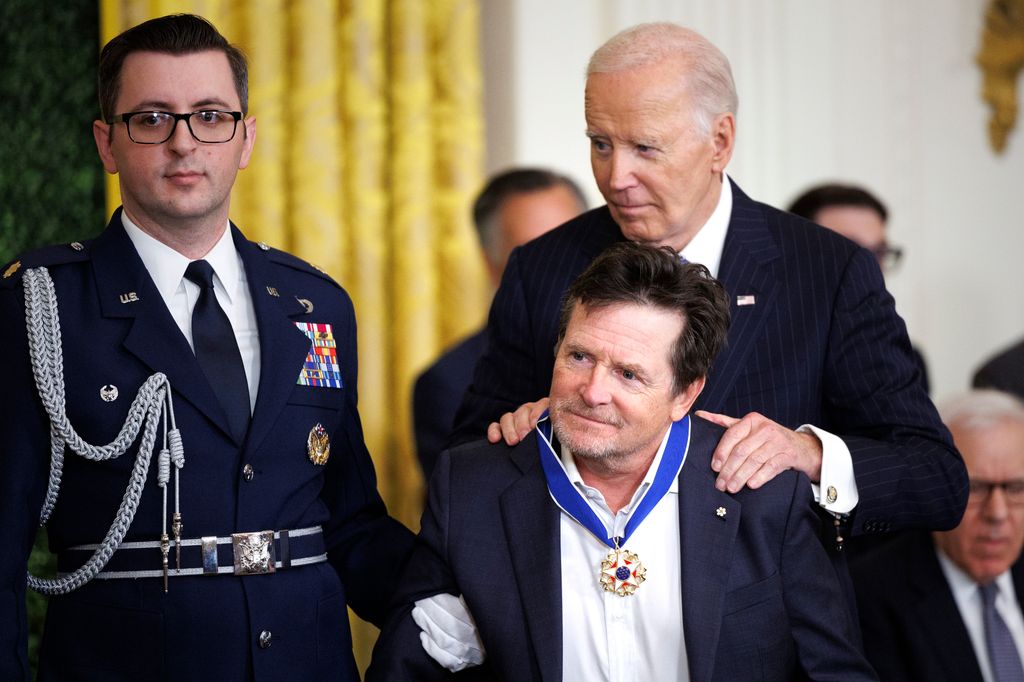 Michael J Fox can’t keep the smile off his face as he is awarded US’ highest honor by President Biden