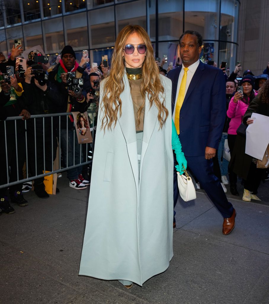 Jennifer Lopez is a vision in plunging slinky gown and seriously killer ...