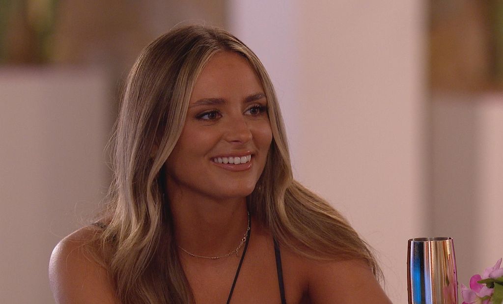 Leah sits across from date on love Island