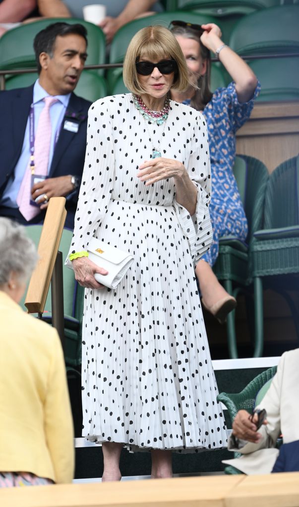 Anna Wintour wearing a pleated polka dot dress 